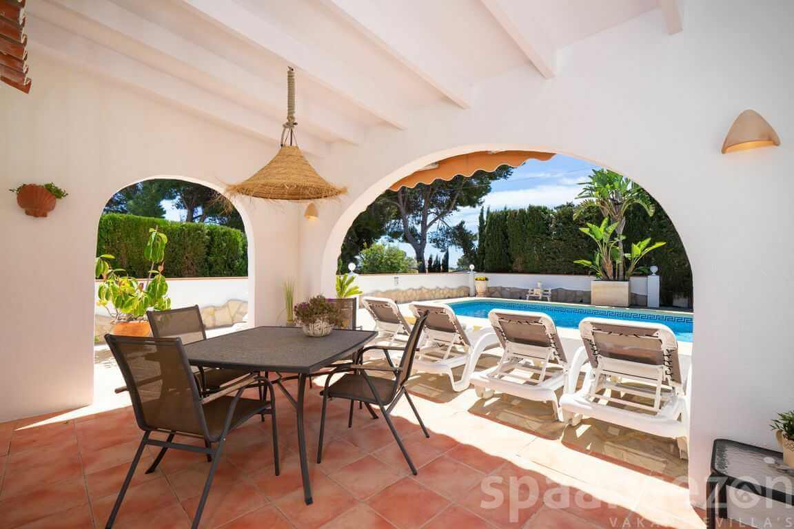 Casa Alicia with covered terrance in the back garden nearby the pool