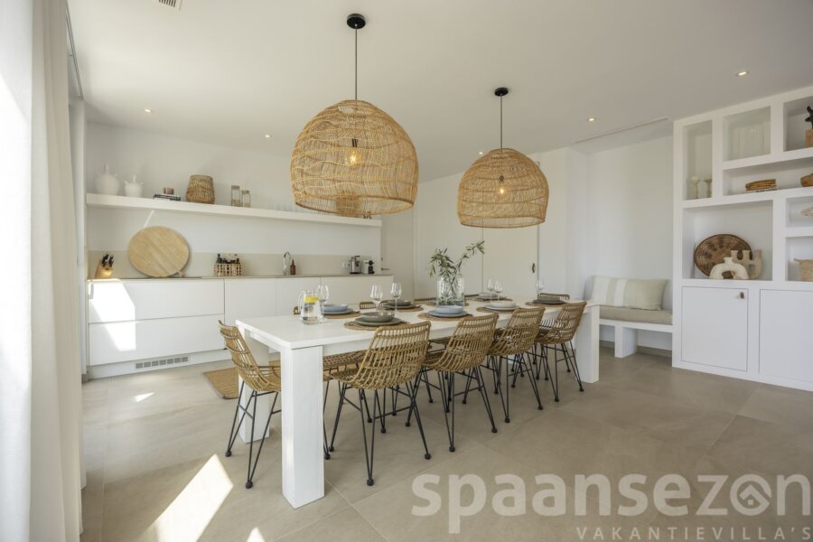 Open kitchen with huge dinning table in the middle