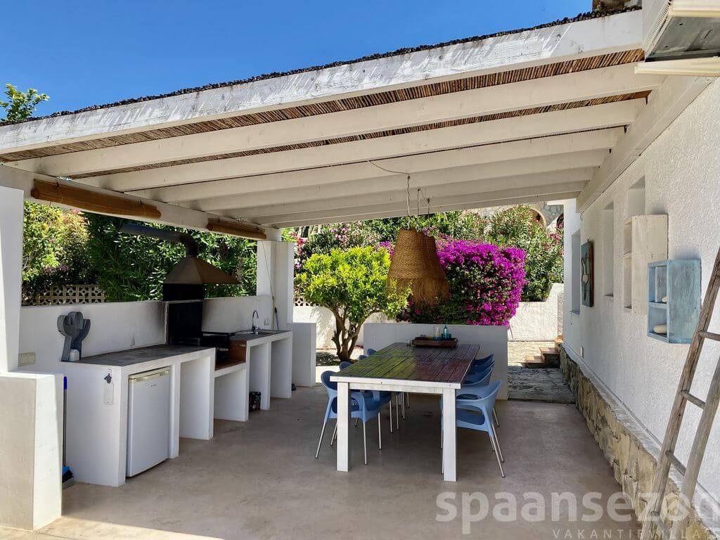 Luxury holiday villa in Moraira with a large BBQ area with a spacious dining table.