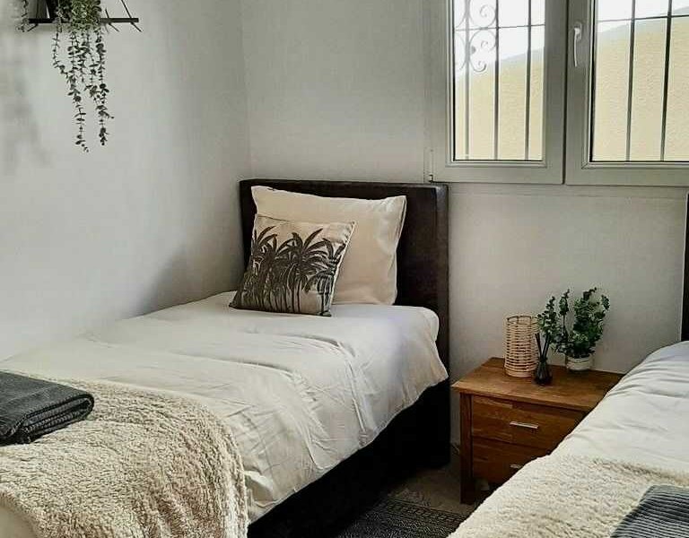 Two single beds in bedroom at villa Terramar Benissa Costa
